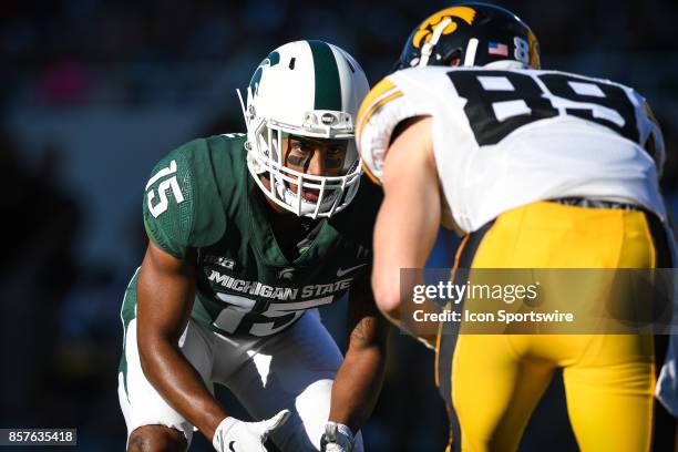 Spartans cornerback Tyson Smith lines up across from Hawkeyes wide receiver Matt VandeBerg during a Big Ten Conference NCAA football game between...