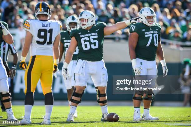 Spartans offensive lineman Brian Allen points out the defensive alignment during a Big Ten Conference NCAA football game between Michigan State and...