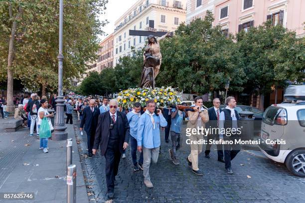 The bearers carry the statue for the Solemn celebrations and procession in honor of St. Francis of Assisi patron of Italy, took place to Trastevere...
