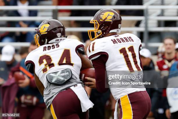 Central Michigan quarterback Shane Morris fakes the hand off to Central Michigan running back Romello Ross during a game between the Boston College...