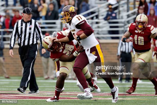 Central Michigan quarterback Shane Morris stiff arms Boston College linebacker John Lamot during a game between the Boston College Eagles and the...