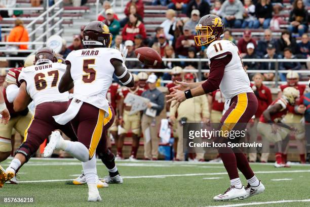 Central Michigan quarterback Shane Morris tosses the ball to Central Michigan running back Jonathan Ward during a game between the Boston College...
