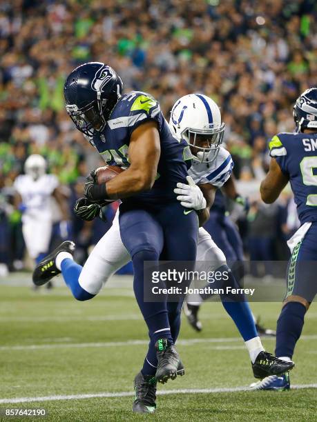 Bobby Wagner of the Seattle Seahawks recovers a fumble for a touchdown against the Indianapolis Colts at CenturyLink Field on October 1, 2017 in...