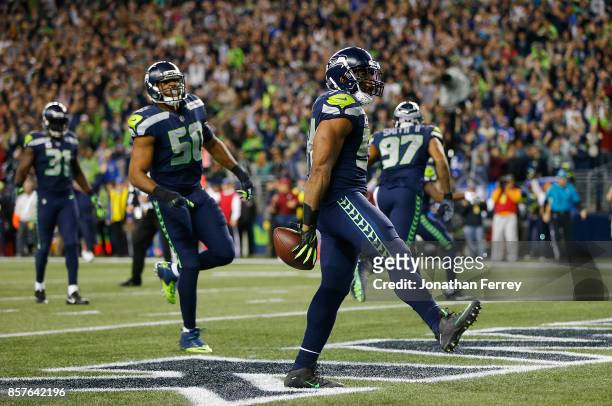 Bobby Wagner of the Seattle Seahawks celebrates a fumble recovery for a touchdown against the Indianapolis Colts at CenturyLink Field on October 1,...