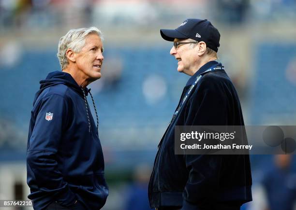 Head Coach Pete Carroll of the Seattle Seahawks speaks with team owner Paul Allen before the game against the Indianapolis Colts at CenturyLink Field...