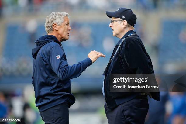 Head Coach Pete Carroll of the Seattle Seahawks speaks with team owner Paul Allen before the game against the Indianapolis Colts at CenturyLink Field...