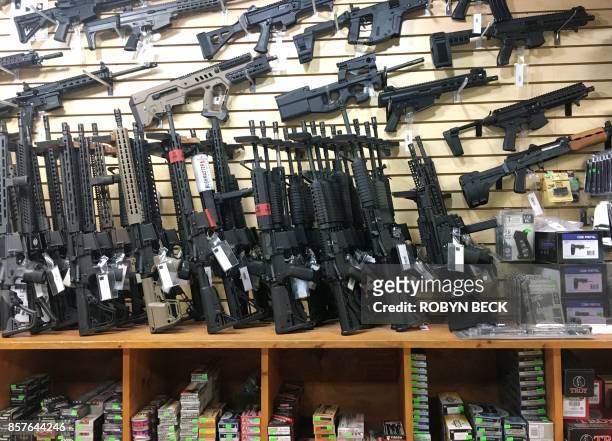 Semi-automatic rifles are seen for sale in a gun shop in Las Vegas, Nevada on October 4, 2017. Mass killer Stephen Paddock used semi-automatic...