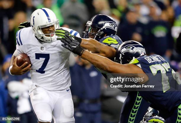 Jacoby Brissett of the Indianapolis Colts is sacked by MIchael Bennett and Bobby Wagner of the Seattle Seahawks at CenturyLink Field on October 1,...