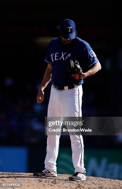 Relief pitcher Jason Grilli of the Texas Rangers prepares to throw during the ninth inning of a baseball game against the Oakland Athletics at Globe...