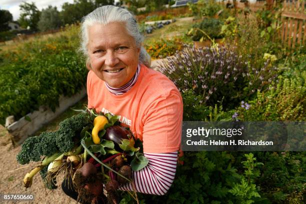 DDENVER, CO - SEPTEMBER 28 - Donna Garnett, shows off some of the abundant produce grown at the Urban Farm at the United Methodist Church-Montbello...