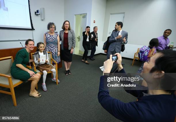 Bana Alabed , the 8-year-old Syrian girl who fled to Turkey from the war-torn Syrian city of Aleppo, attends the introduction and autograph session...