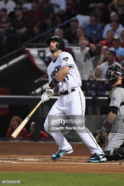 Paul Goldschmidt of the Arizona Diamondbacks watches hits a three run home run during the bottom of the first inning of the National League Wild Card...