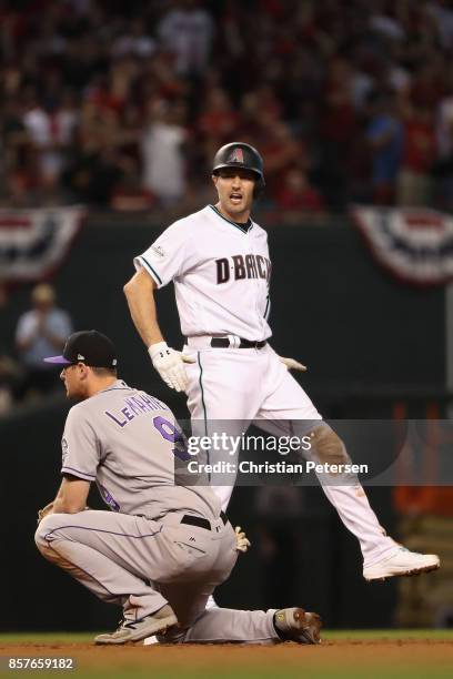 Pollock of the Arizona Diamondbacks celebrates after hitting a double during the bottom of the first inning of the National League Wild Card game...