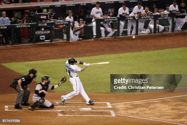 Paul Goldschmidt of the Arizona Diamondbacks hits a three-run homerun during the bottom of the first inning of the National League Wild Card game...