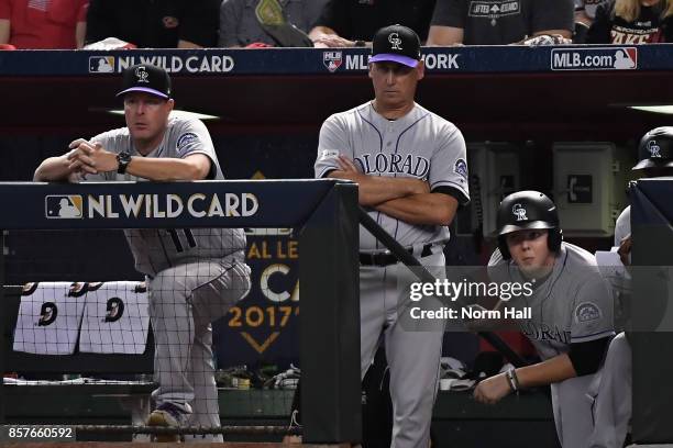 Manager Bud Black of the Colorado Rockies and bench coach Mike Redmond watch the action during the first inning of the National League Wild Card game...