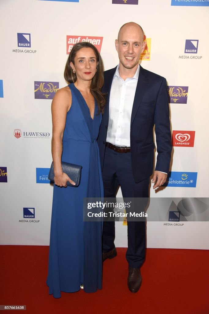 Oliver Petszokat and his wife Pauline Schubert attend the 'Helden des