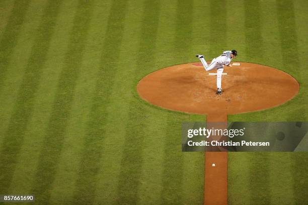 Starting pitcher Zack Greinke of the Arizona Diamondbacks pitches during the top of the first inning of the National League Wild Card game against...