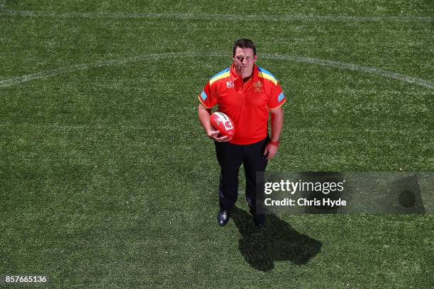 Stuart Dew poses after being appointed Senior Coach during a Gold Coast Suns AFL press conference at their training facility on October 5, 2017 in...