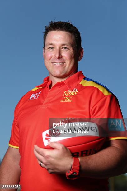 Stuart Dew poses after being appointed Senior Coach during a Gold Coast Suns AFL press conference at their training facility on October 5, 2017 in...