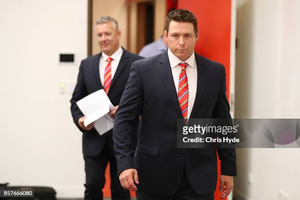 Stuart Dew arrives after being appointed Senior Coach during a Gold Coast Suns AFL press conference at their training facility on October 5, 2017 in...