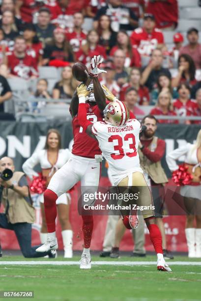 Rashard Robinson of the San Francisco 49ers breaks up a pass to Jaron Brown of the Arizona Cardinals during the game at the University of Phoenix...