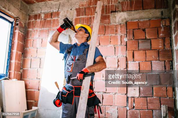 manual worker on a break - beer goggles stock pictures, royalty-free photos & images