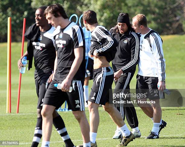 Alan Shearer talks to Jonas Gutierrez during a Newcastle United team training session at the Little Benton Training Ground on April 2, 2009 in...