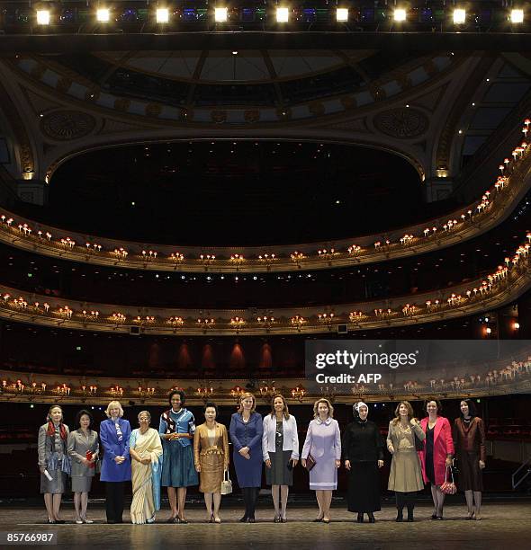Some of the wives of G20 leaders and delegates pose for a group picture during their visit to the Royal Opera House, in London, on April 2, 2009. Ban...