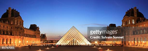 louvre, pyramid framed in arch, paris, france - louvre pyramid stock pictures, royalty-free photos & images