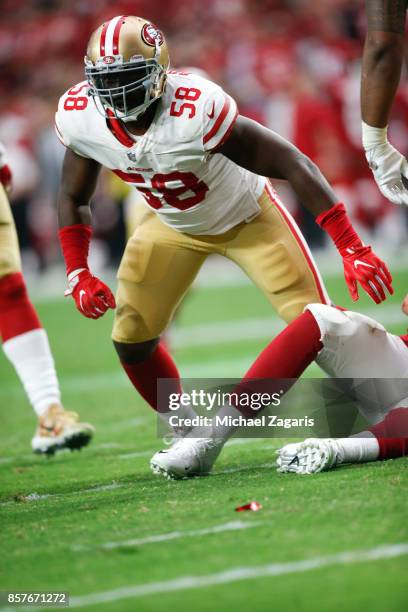 Elvis Dumervil of the San Francisco 49ers defends during the game against the Arizona Cardinals at the University of Phoenix Stadium on October 1,...