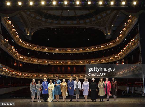 Some of the wives of G20 leaders and delegates pose for a group picture during their visit to the Royal Opera House, in London, on April 2, 2009. Ban...