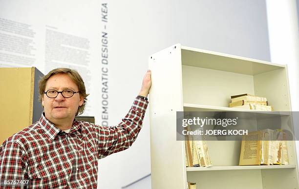 Lars Dafnaes, leader of the design department at Swedish flat pack furniture company IKEA, poses next to a "Billy" shelf by Ikea on April 2, 2009 at...