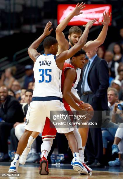 Jarell Eddie of the Chicago Bulls controls the ball against PJ Dozier of the Dallas Mavericks and Maximilian Kleber of the Dallas Mavericks in the...