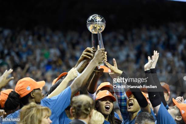 The Minnesota Lynx raise the Championship trophy after defeating the Los Angeles Sparks in Game Five of the WNBA Finals on October 4, 2017 at...