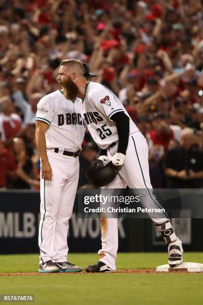 Archie Bradley of the Arizona Diamondbacks reacts after hitting aN RBI triple during the bottom of the seventh inning of the National League Wild...