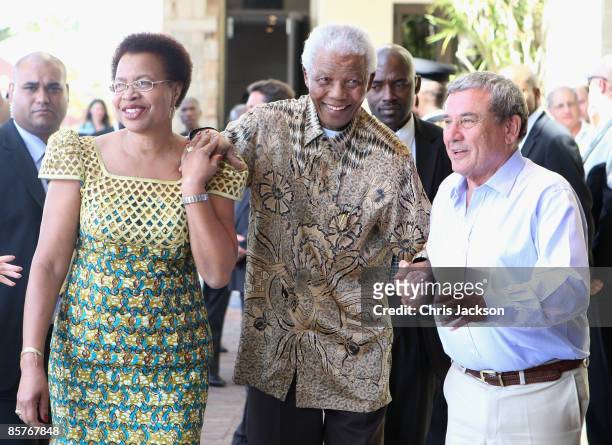 Graca Machel and Nelson Mandela greet Sol Kerzner as they arrive at the new One&Only Cape Town resort on April 2, 2009 in Cape Town, South Africa....