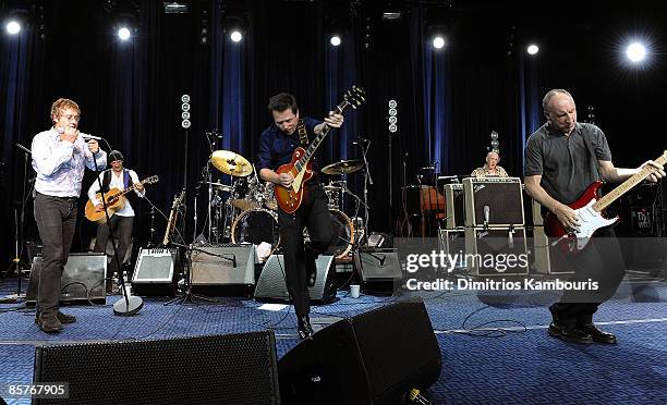 Michael J. Fox performs on stage with Roger Daltrey and Pete Townshend of The Who during "A Funny Thing Happened on the Way to Cure Parkinson's" 2008...