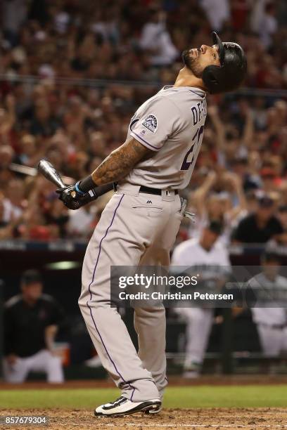 Ian Desmond of the Colorado Rockies reacts after striking out during the top of the seventh inning during the National League Wild Card game against...