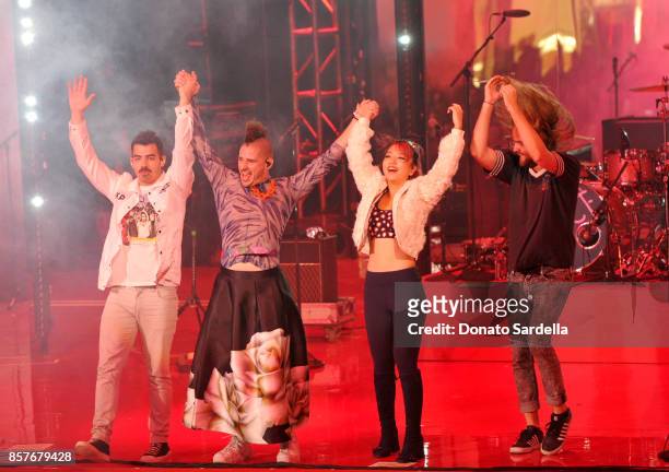 Joe Jonas, Cole Whittle, JinJoo Lee and Jack Lawless of DNCE perform onstage at the Westfield Century City Reopening Celebration on October 3, 2017...