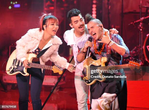 JinJoo Lee, Joe Jonas and Cole Whittle of DNCE perform onstage at the Westfield Century City Reopening Celebration on October 3, 2017 in Century...