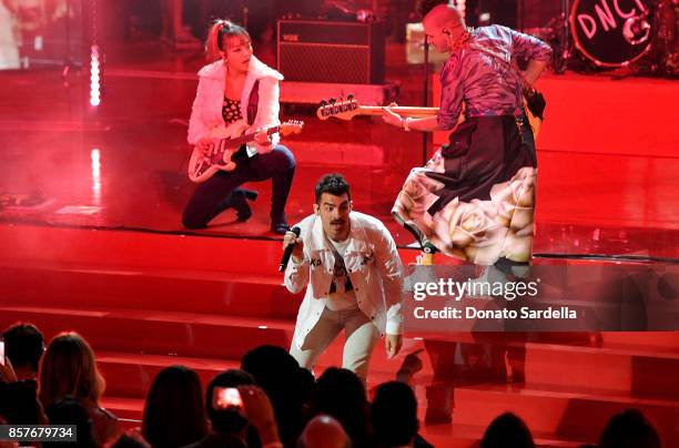 JinJoo Lee, Joe Jonas and Cole Whittle of DNCE perform onstage at the Westfield Century City Reopening Celebration on October 3, 2017 in Century...
