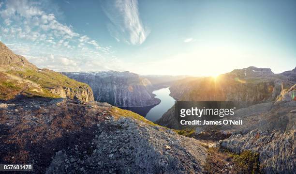 mountainous landscape and fjord at sunset, norway - terreno accidentato foto e immagini stock