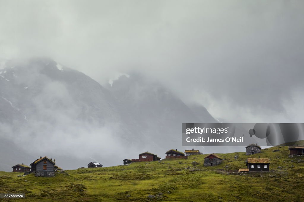 Mountain huts with background mountains