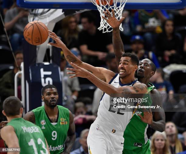 Thabo Sefolosha of the Utah Jazz passes the ball in front of Brandon Bowman of the Maccabi Haifa during the second half of the 117-78 win by the Jazz...
