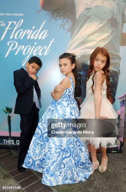 Cast members Christopher Rivera, Brooklynn Prince and Valeria Cotto pose during "THE FLORIDA PROJECT" Cast & Crew Orlando Premiere at The Enzian...