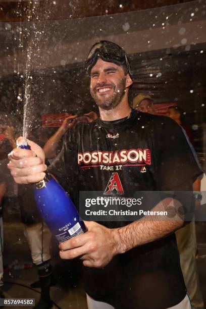 Martinez of the Arizona Diamondbacks celebrates in the locker room after defeating the Colorado Rockies 11-8 in the National League Wild Card game at...