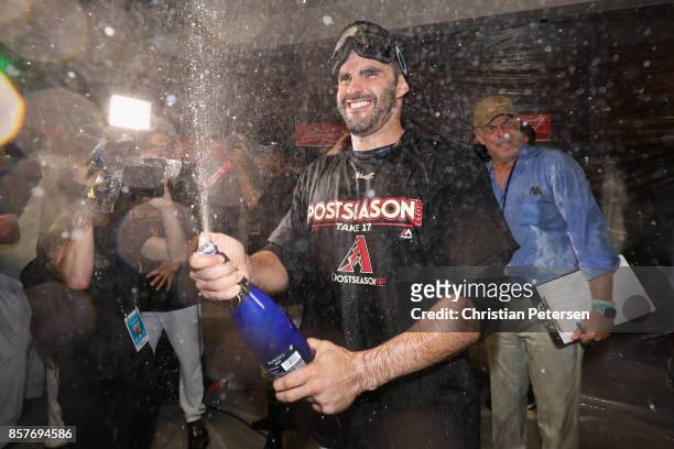 Martinez of the Arizona Diamondbacks celebrates in the locker room after defeating the Colorado Rockies 11-8 in the National League Wild Card game at...