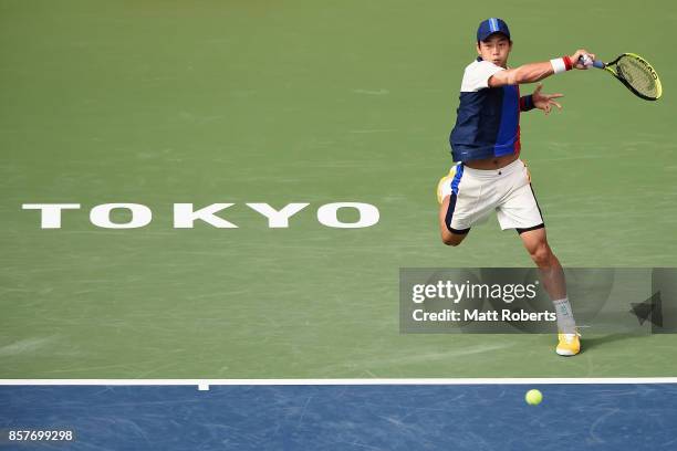 Yen-Hsun Lu of Chinese Taipei plays a forehand against Richard Gasquet of France during day four of the Rakuten Open at Ariake Coliseum on October 5,...