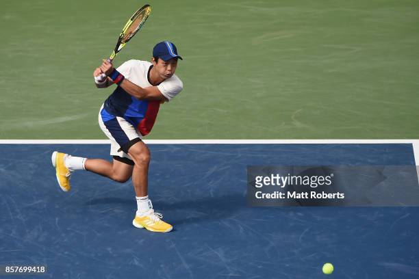 Yen-Hsun Lu of Chinese Taipei plays a backhand against Richard Gasquet of France during day four of the Rakuten Open at Ariake Coliseum on October 5,...