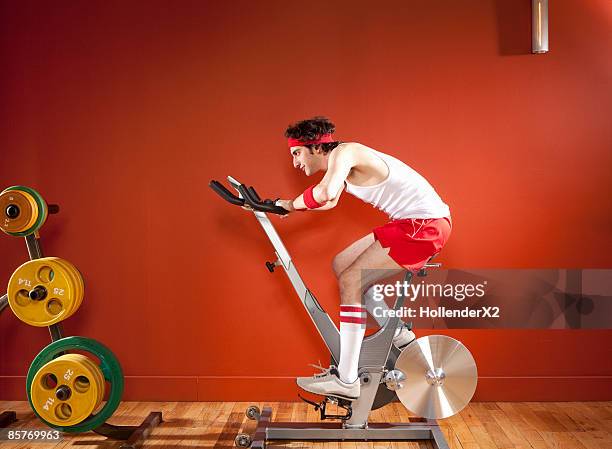 man on exercise bike with headband and kneesocks - headband 個照片及圖片檔